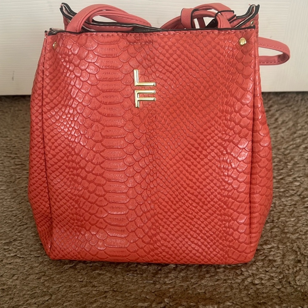 Salmon colored faux crocodile small purse